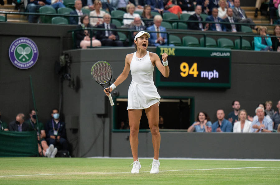 British Tennis Sensation Emma Raducanu Mid-stretch Wallpaper