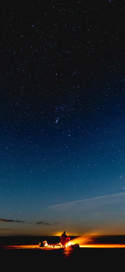 Campfire Starry Night At Beach Wallpaper