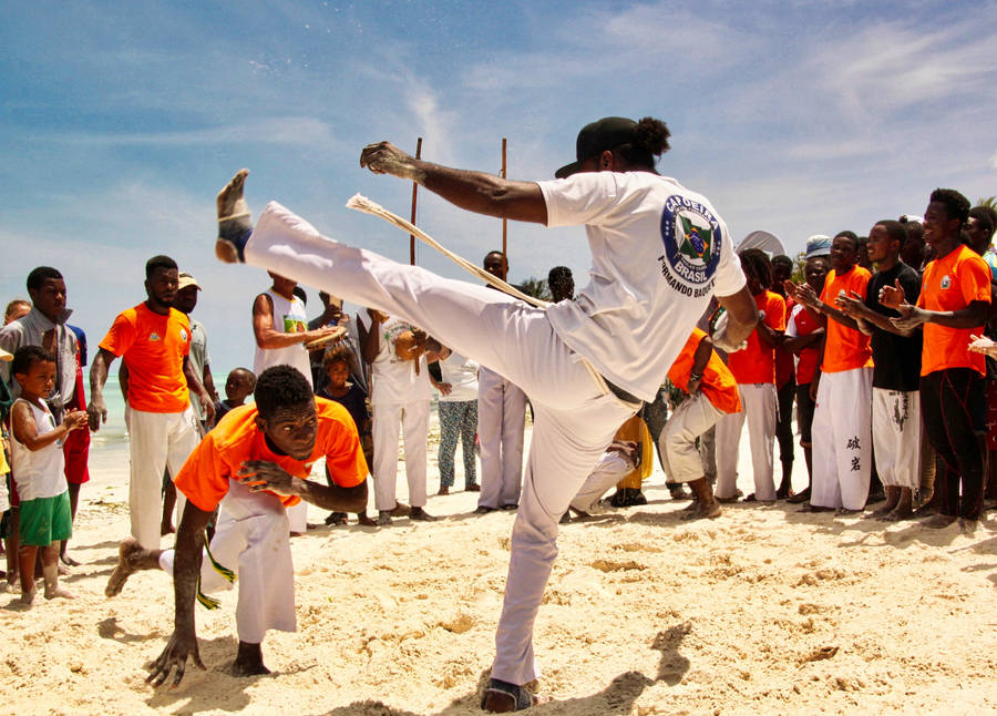 Capoeira Sparring At A Beach Wallpaper