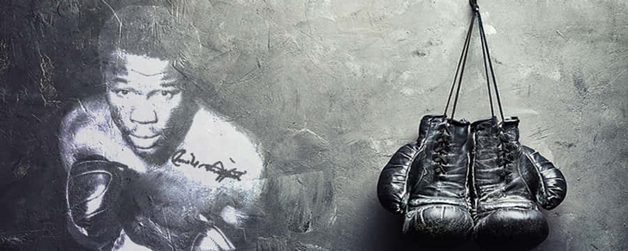 Caption: Boxing Legend Emile Griffith With His Gloves On Wallpaper