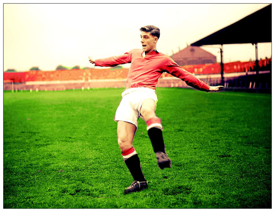 Caption: British Soccer Icon Duncan Edwards In Action Wallpaper