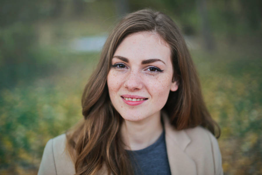 Caption: Confident Corporate Woman: A Headshot Wallpaper