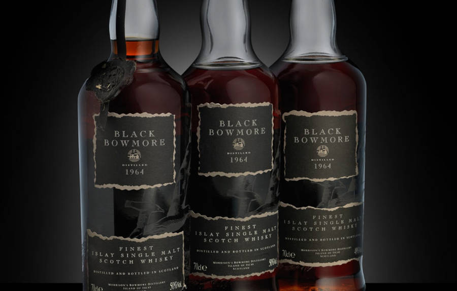 Caption: Elegant Black Bowmore Whisky Bottles On Display Wallpaper