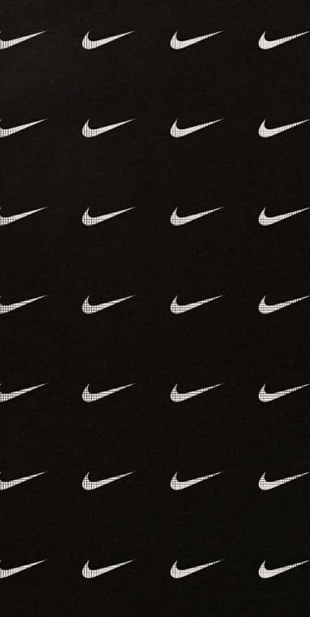 Caption: Iconic Black Nike Sneakers Wallpaper