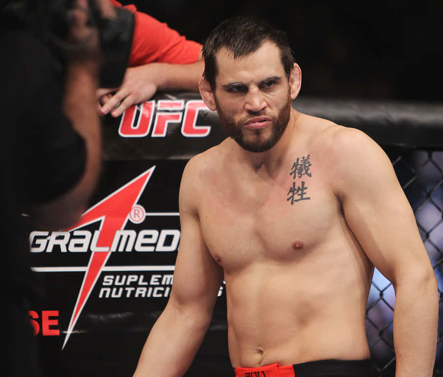 Caption: Jon Fitch's Intense Stare At Ufc 141 Event Wallpaper