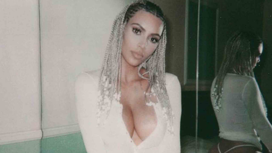 Caption: Kim Kardashian Flaunting Her Elegant Style Wallpaper