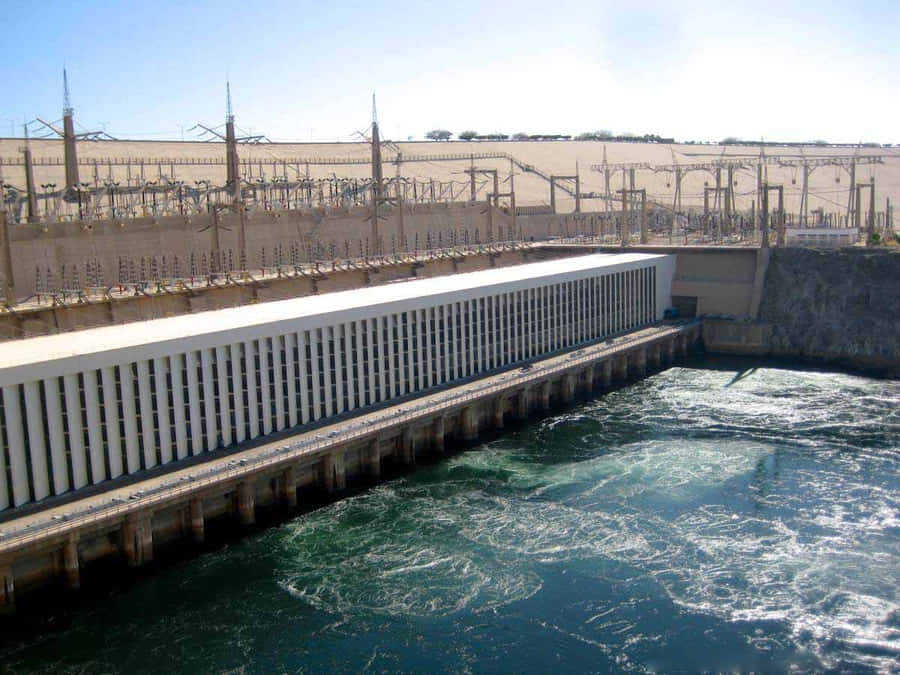 Caption: Majestic Aswan High Dam – Powering Egypt Wallpaper