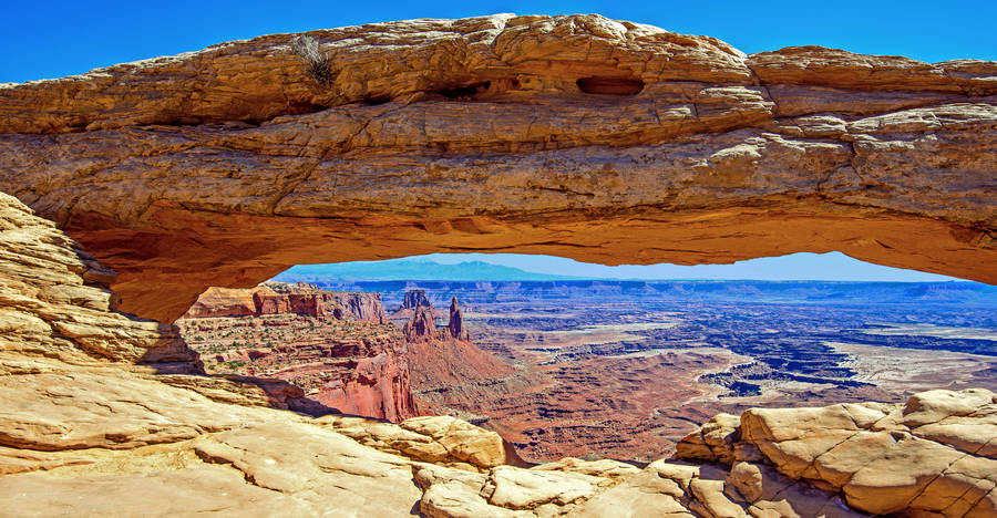 Caption: Majestic Long Rock Formation In Canyonlands National Park Wallpaper