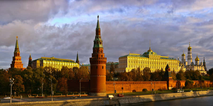 Caption: Majestic Sunset Over The Kremlin Grand Palace Wallpaper