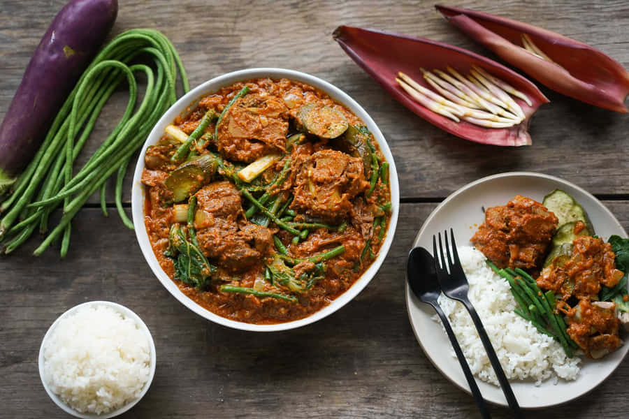 Caption: Sumptuous Kare-kare Filipino Stew - A Taste Of Authenticity Wallpaper