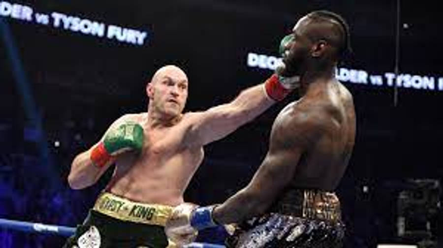 Caption: Tyson Fury Celebrating His Victory In The Ring Wallpaper