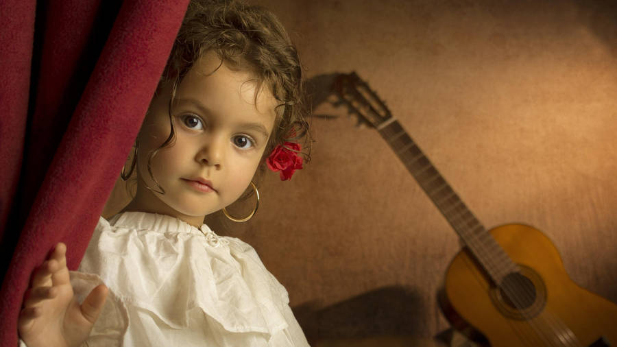 Captivating Melody: Cute Girl With Guitar Wallpaper
