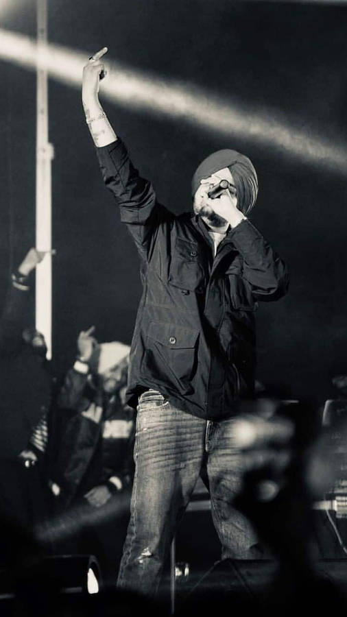 Captivating Snapshot Of Sidhu Moose Wala Energizing The Audience Wallpaper