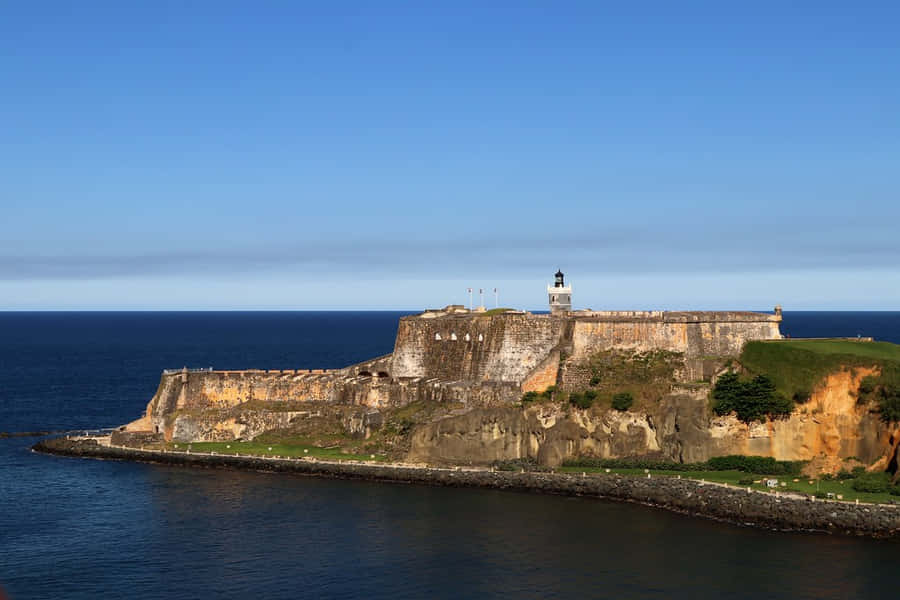 Castillo San Felipe Del Morro And Calm Sea Wallpaper