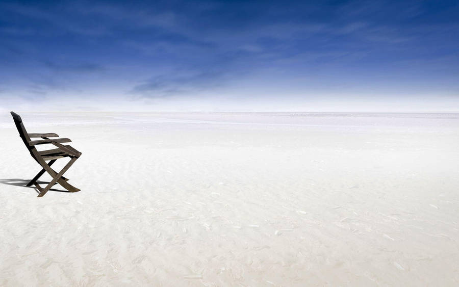 Chair On Quiet Snowy Plain Wallpaper