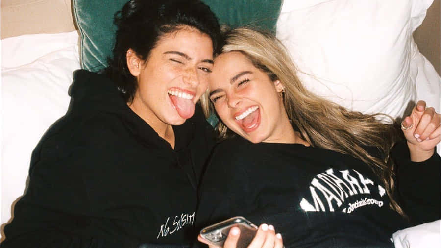 Charli And Addison Lying On The Bed Wallpaper