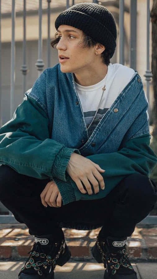 Chase Hudson Gucci Boots And Blue Denim Jacket Wallpaper