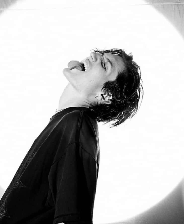 Chase Hudson Looking Confident In The Spotlight. Wallpaper