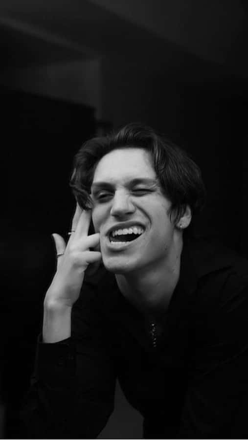 Chase Hudson Looking Up At The Night Sky Wallpaper