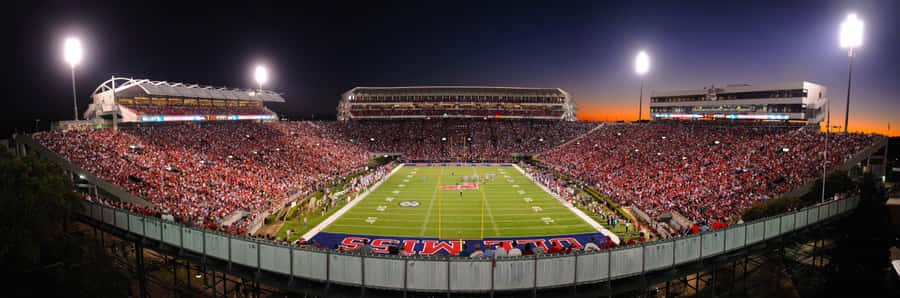 Cheering On The Rebels At The Ole Miss Stadium Wallpaper