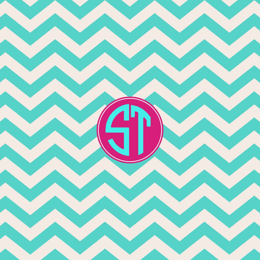 Chevron Pattern With A Monogram On It Wallpaper