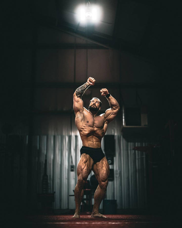 Chris Bumstead Vacuum Bodybuilding Pose Wallpaper