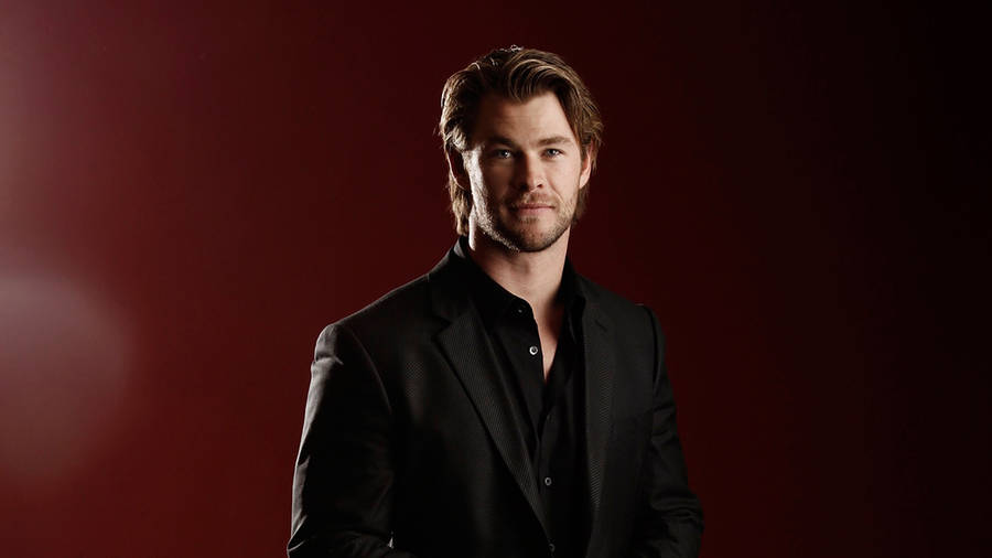 Chris Hemsworth In A Black Formal Outfit Wallpaper