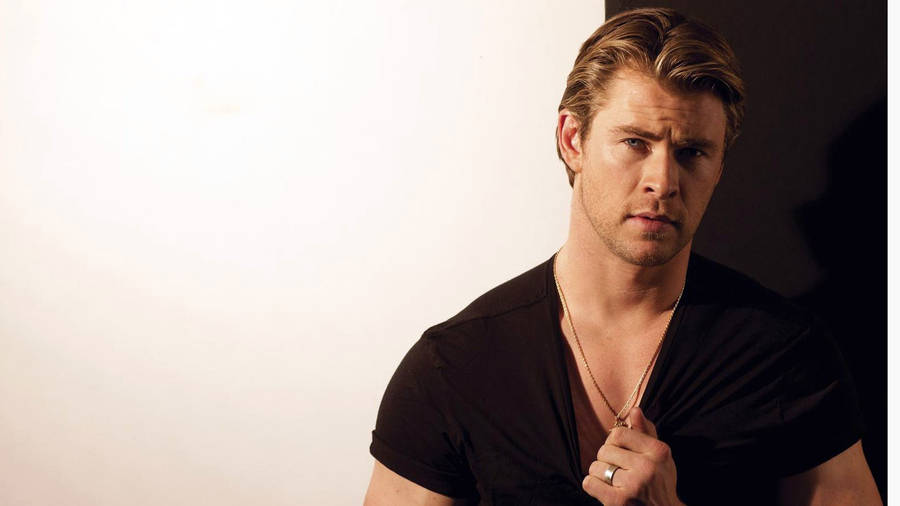 Chris Hemsworth In A Black Shirt Wallpaper
