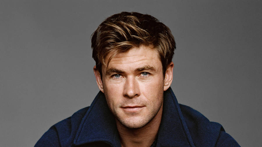 Chris Hemsworth Strikes A Pose In A Blue Jacket. Wallpaper