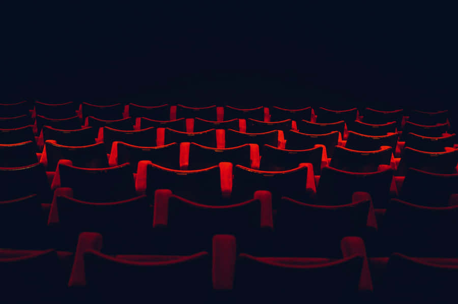 Cinema Seatsin Dark Theater Wallpaper