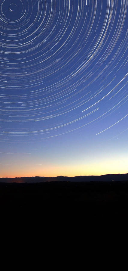 Circular Lines On Sky Punch Hole 4k Wallpaper