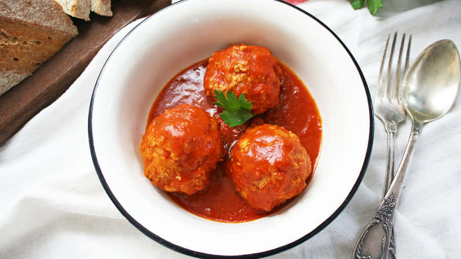 Classic Meatballsin Tomato Sauce Wallpaper