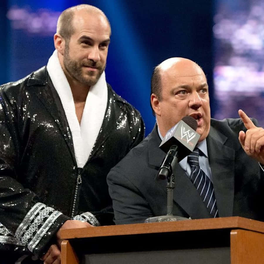Claudio Castagnoli In Shiny Robe With Paul Heyman Wallpaper