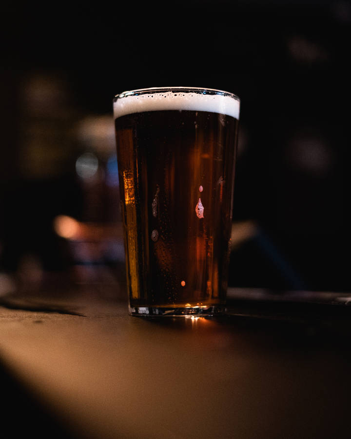 Clear Drinking Glass With Beer Wallpaper