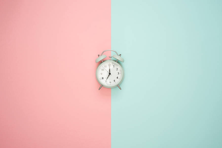 Clock On Pastel Backdrop Wallpaper
