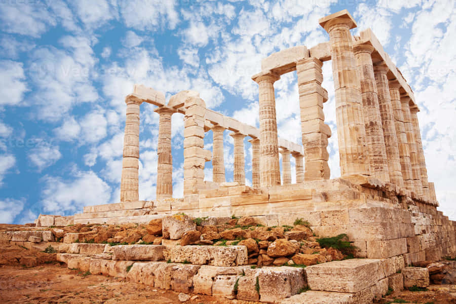 Cloudy Stone Pillars In Sounion Wallpaper