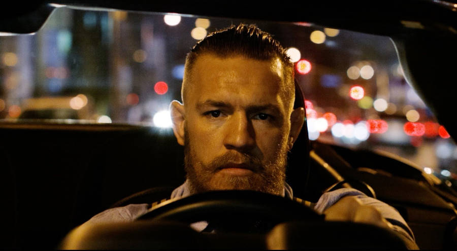 Conor Mcgregor Driving Car Wallpaper