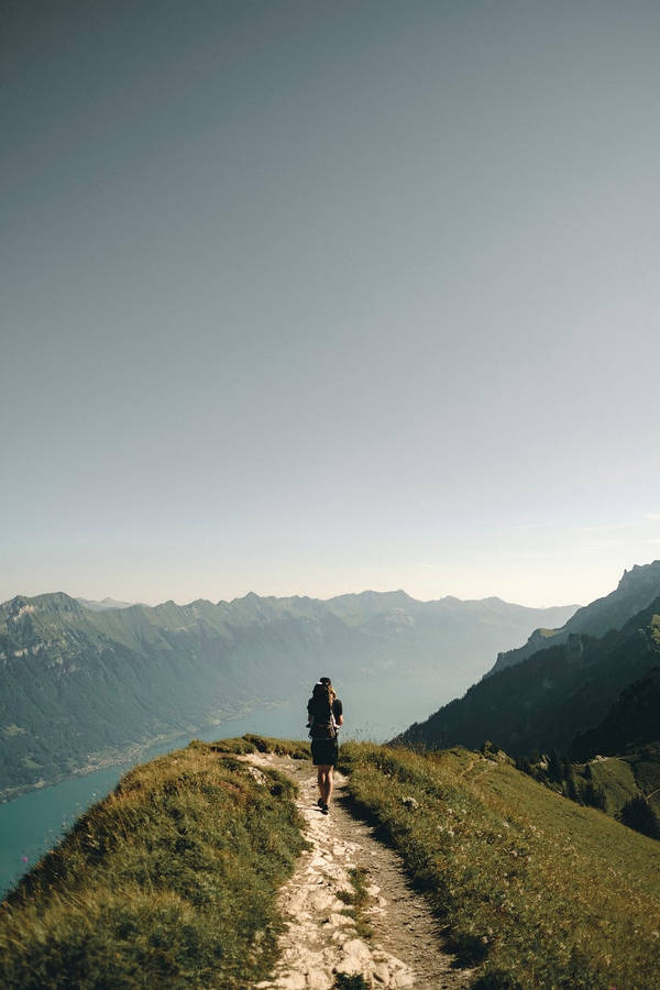 Conquering The Peak: Hiking Adventure Wallpaper