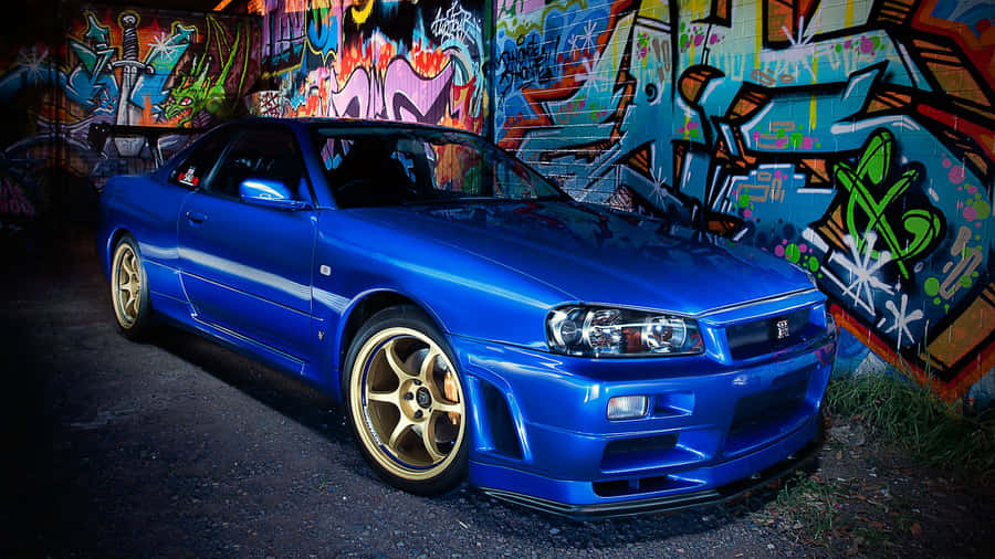 Cool Nissan Skyline Gtr In Blue With Gold Mags Wallpaper
