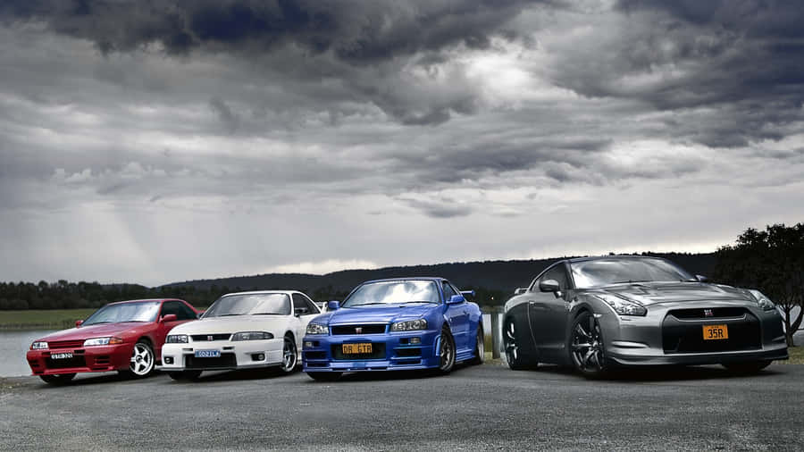 Cool Nissan Skyline Gtrs Next To Each Other Wallpaper
