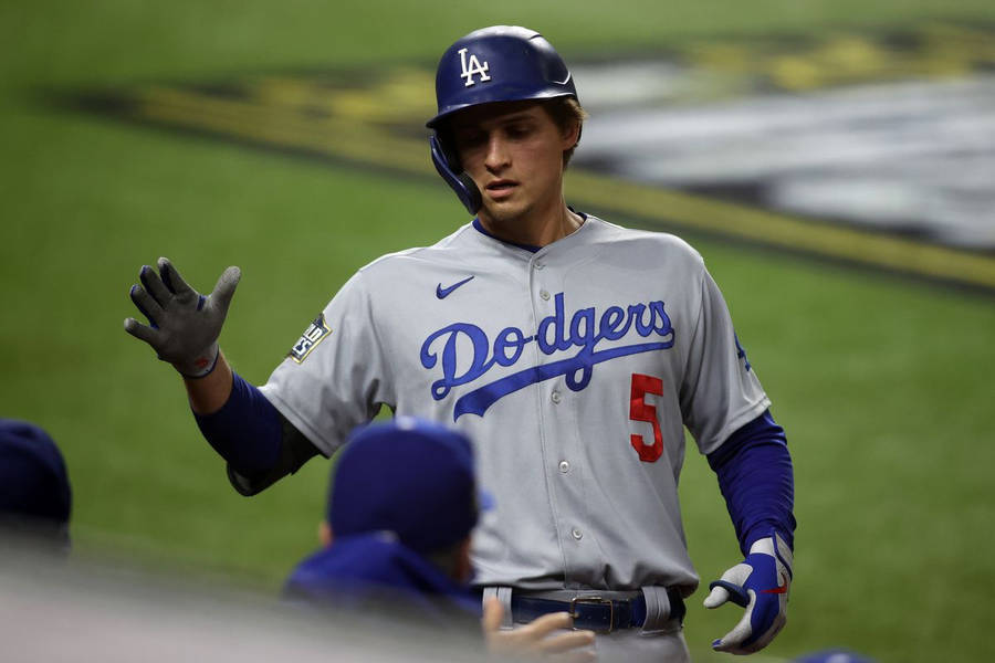 Corey Seager High Fiving Teammates Wallpaper