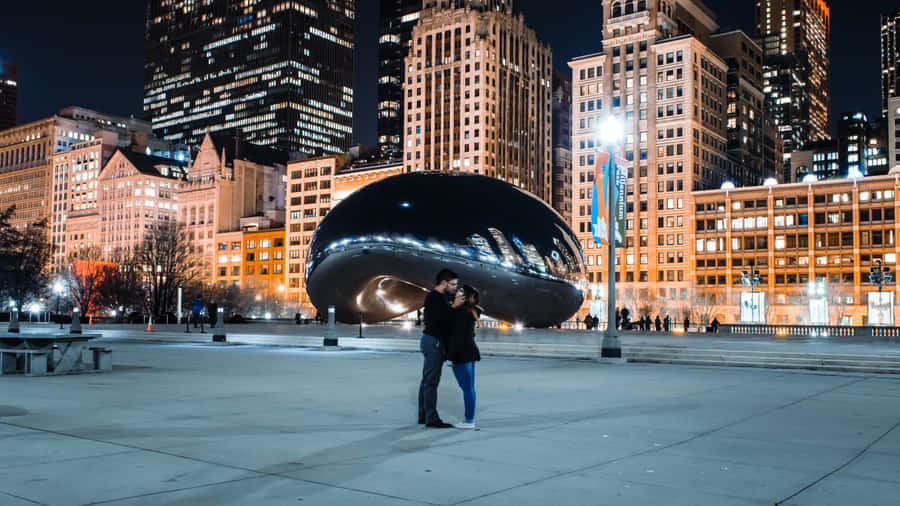 Couple Hug At Cloud Gate In Millennium Park Wallpaper