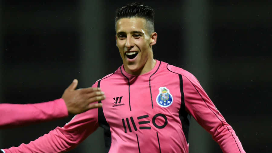 Cristian Tello Celebratingin Pink Jersey Wallpaper