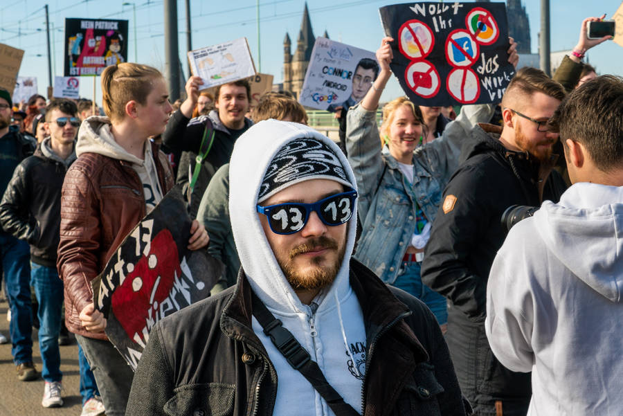 Crowd Of People At The Street Rallying Wallpaper