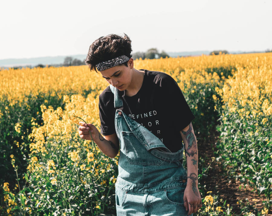 Cute Tomboy In Flower Field Wallpaper