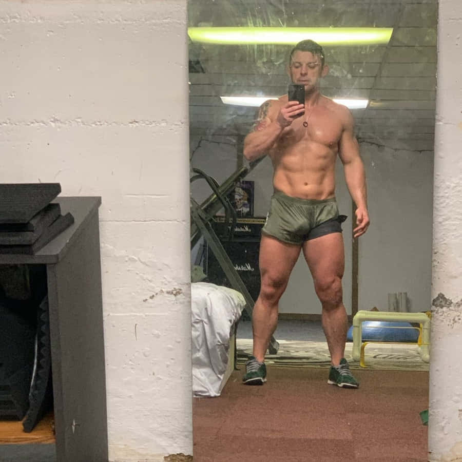 Davey Richards Showing Off Physique In Intense Workout Session Wallpaper