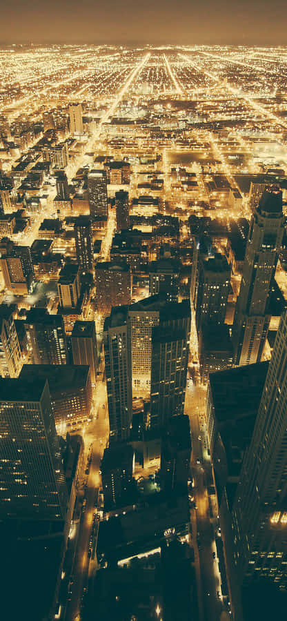 Dazzling Lights Illuminate The City Of Chicago At Night Wallpaper
