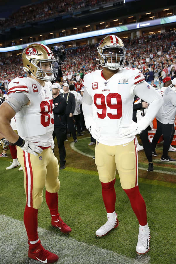 Deforest Buckner And George Kittle - Power Players Of Nfl Wallpaper