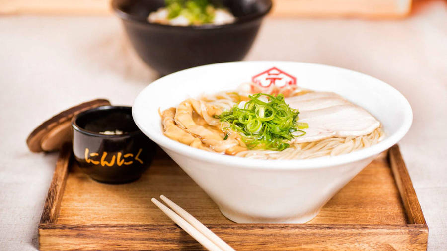 Delectable Hakata Ramen Served In A White Dining Ware Wallpaper