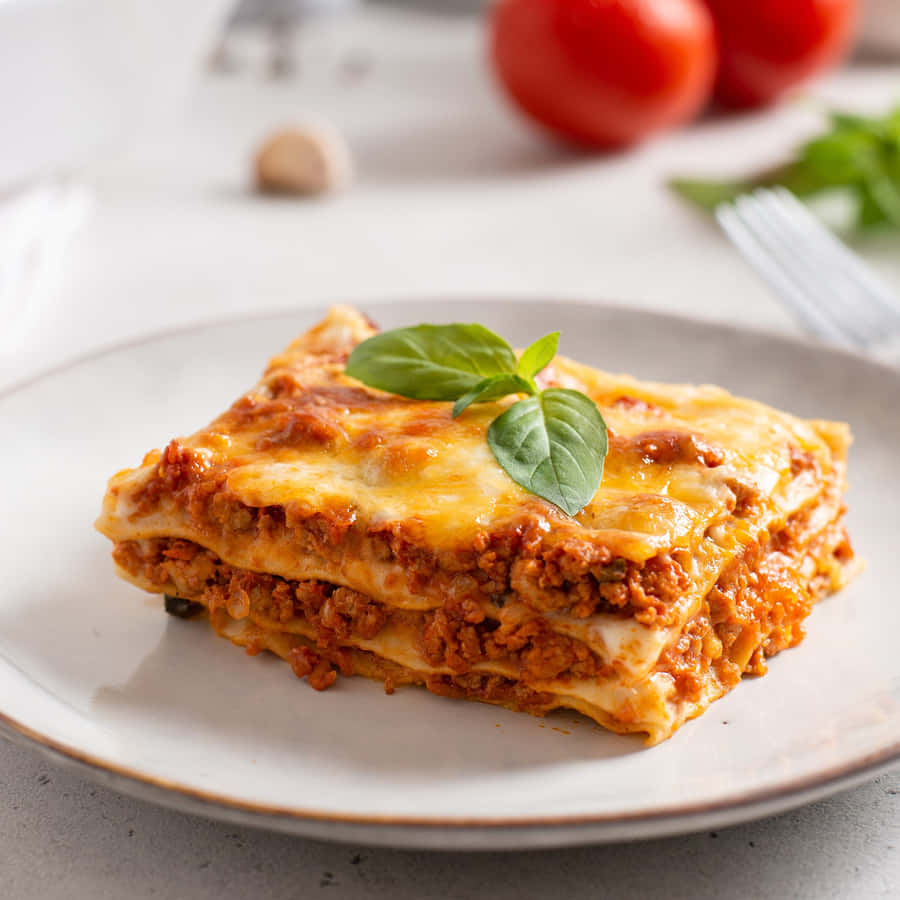 Delectable Slice Of Lasagna Alla Bolognese Wallpaper